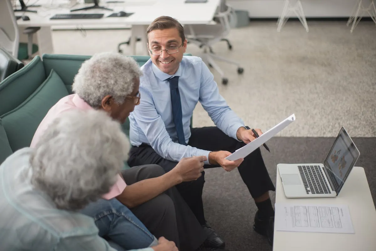 A licensed agent reviewing plan options with a senior couple
